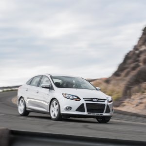 2014-Ford-Focus-Titanium-front-three-quarters-in-motion.jpg